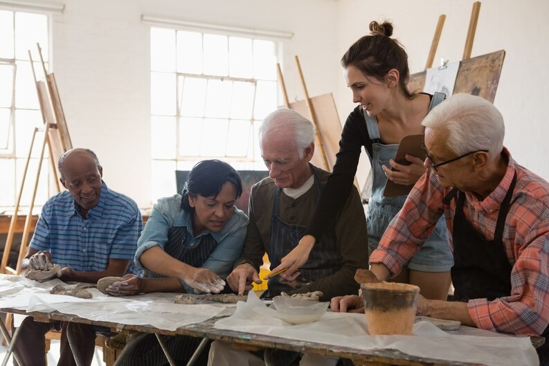 A senior community service professional training a team.