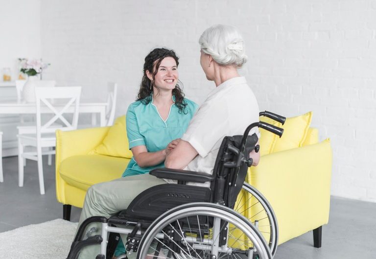 Support worker assisting an elderly individual.