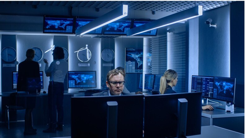 Team in a control room responding to a cybersecurity incident.