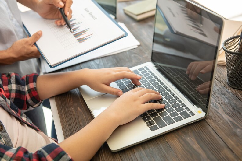 A student applying for a work placement on a laptop.