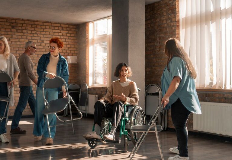 Group of caregivers assisting elderly and disabled individuals.