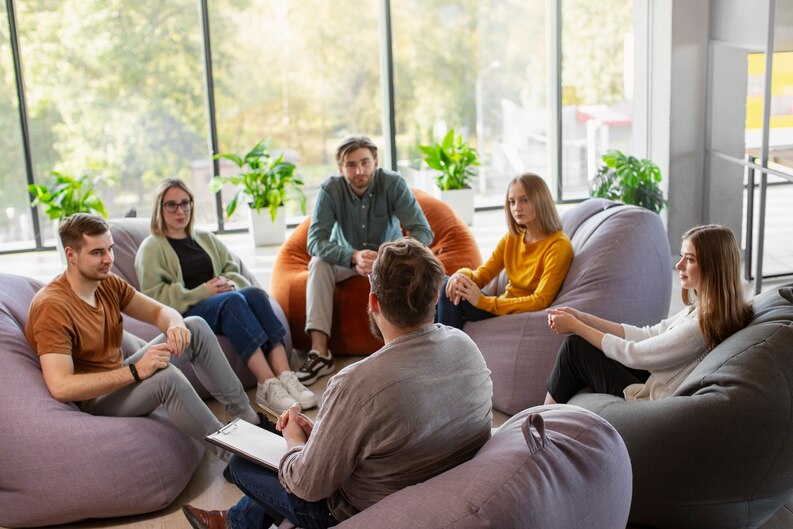 A group of mental health students engaging in a practical training session.