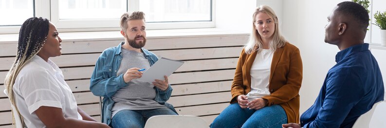 A mental health support worker assisting a client during a counseling session.