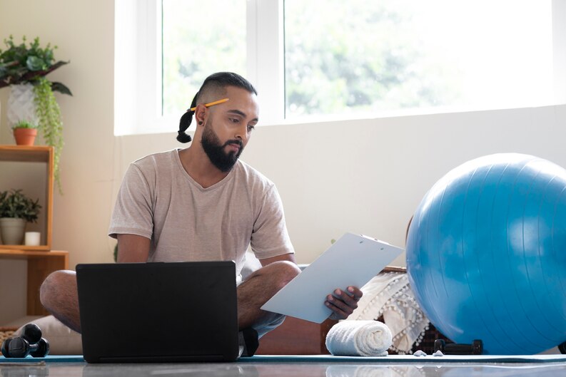 A professional taking an online course on a laptop, improving career-related skills