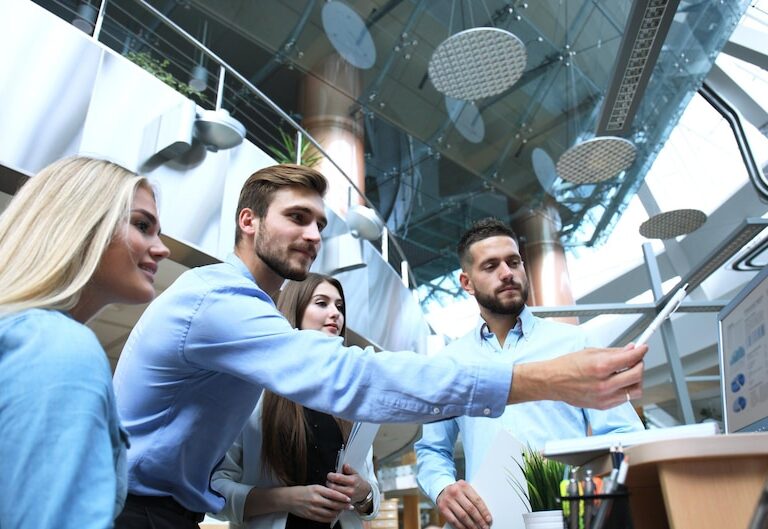 Professionals engaging in a networking event, exchanging ideas and contact information.