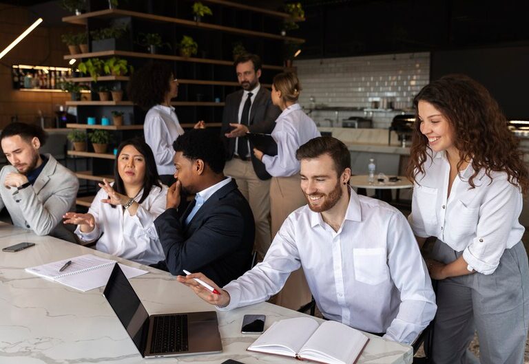 Professionals engaging in a networking event, exchanging ideas and contact information.