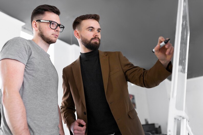 Intern working with mentor in a professional office.