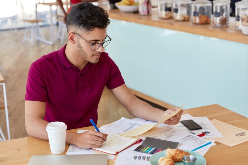 A student performing a hands-on task in a professional setting