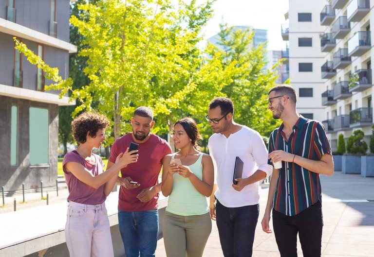 Youth workers engaging with diverse groups of young people in community settings.