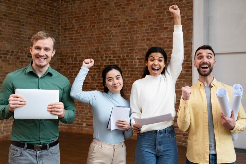 A group of happy interns receiving certificates at the end of their successful work placement.
