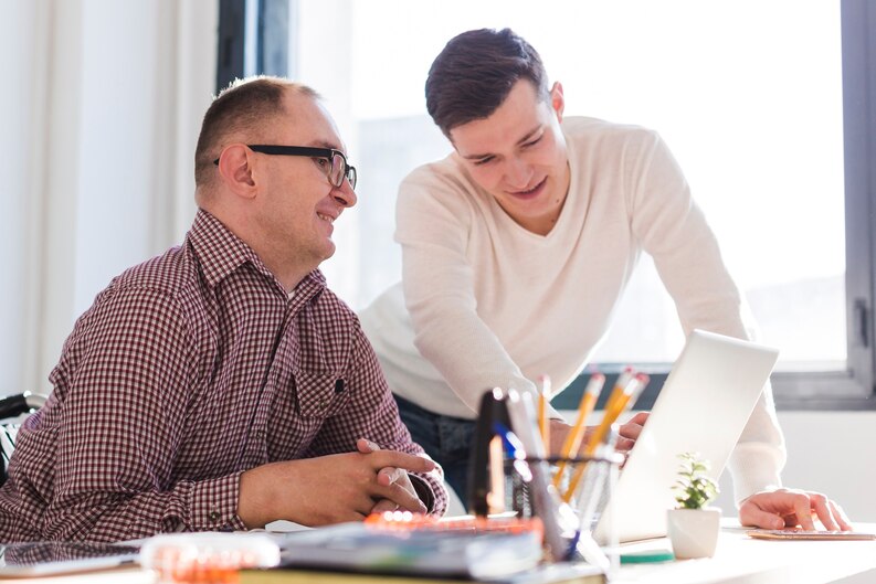 Student gaining hands-on experience under the guidance of a mentor in a professional setting.