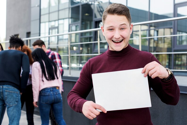 Student smiling with job offer in hand