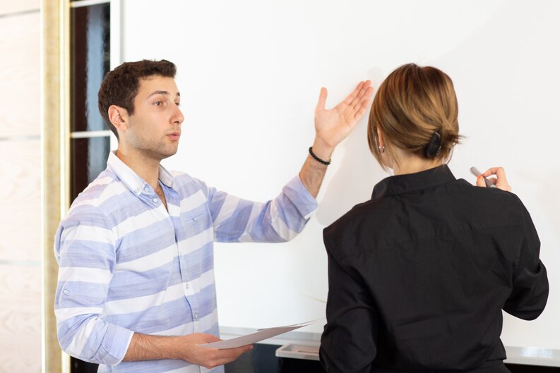 Student having a feedback discussion with manager.