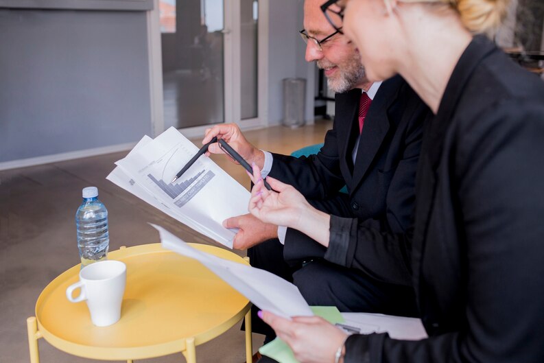 Student submitting practical placement forms to supervisor