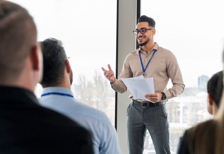 Confident graduate speaking at a career development event