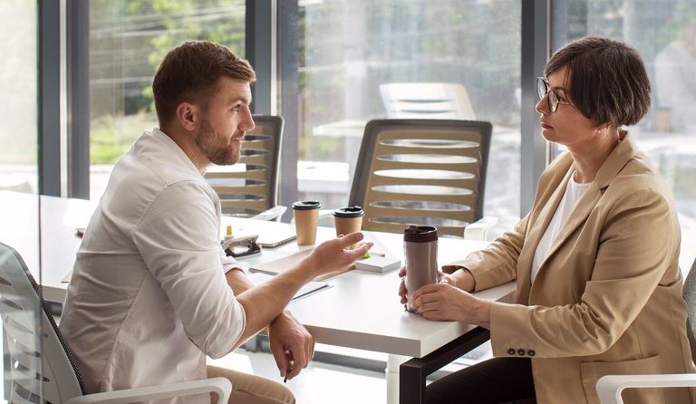 Mentor and mentee discussing career growth