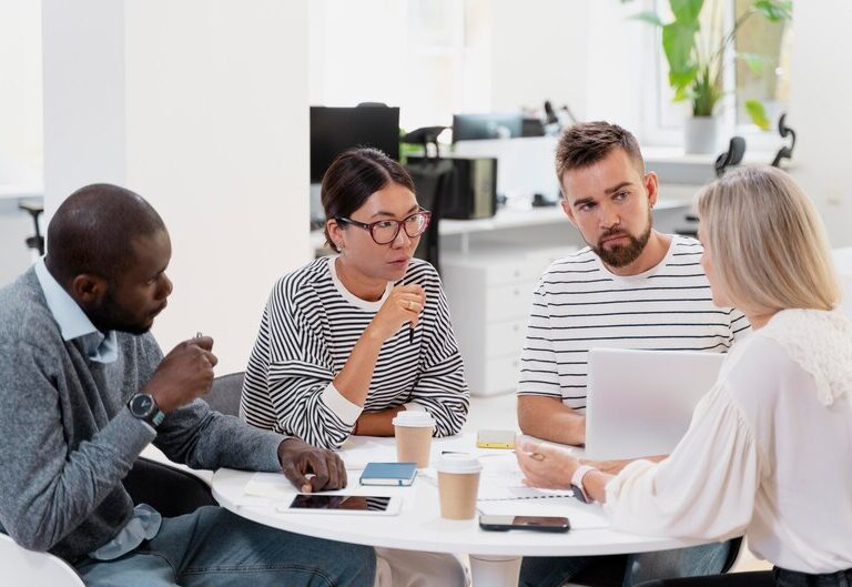 Intern learning during a team meeting