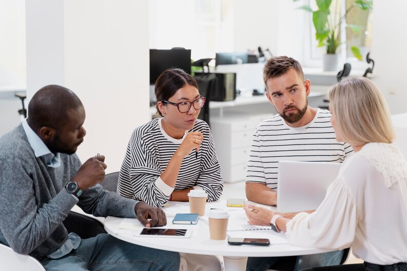 Intern learning during a team meeting