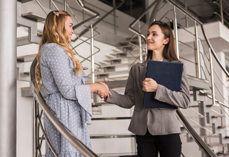 Confident student intern meeting mentor