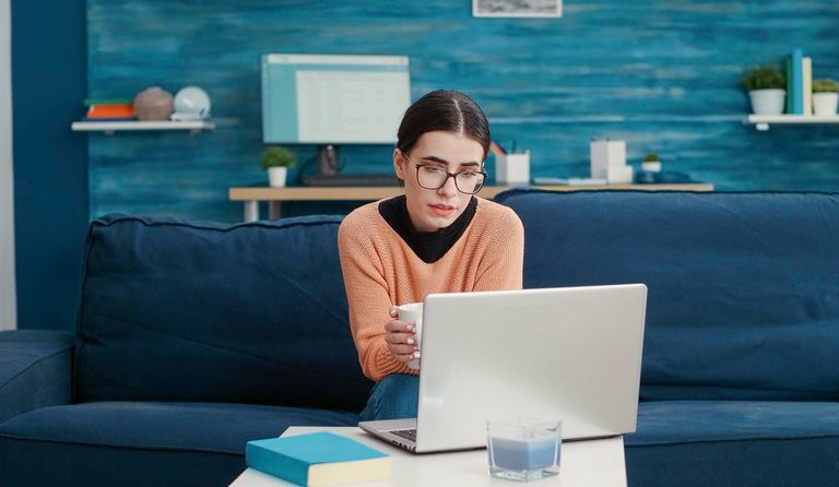 Student attending a virtual internship from home on a laptop