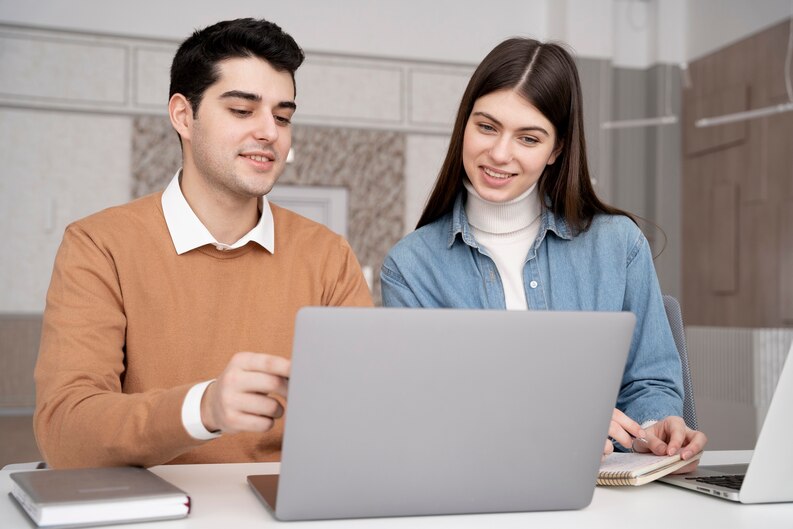 Mentor helping intern during a professional training session