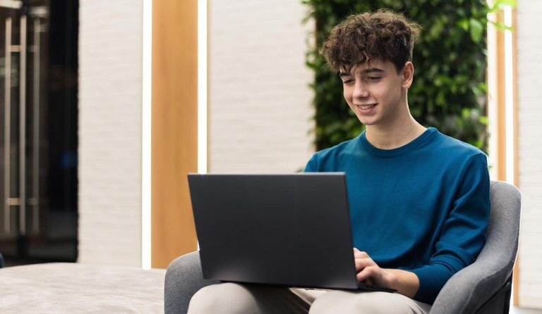 Student attending a virtual internship from home on a laptop