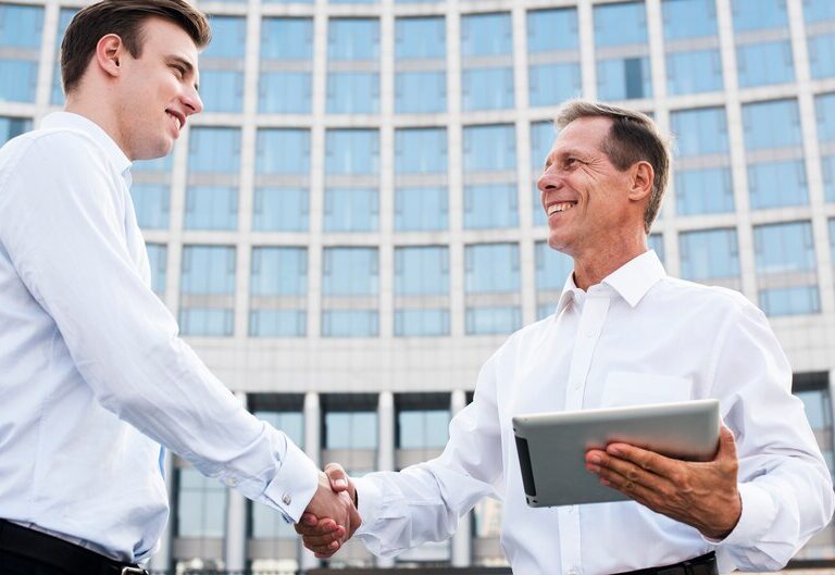 Student and industry professional shaking hands
