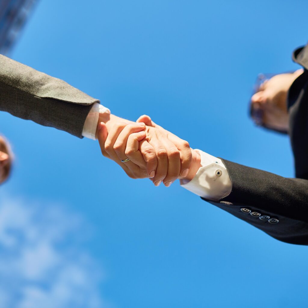 Professionals shaking hands after successful communication